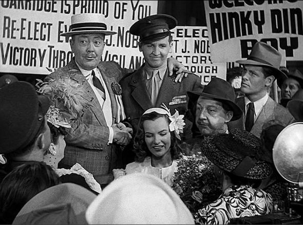 Raymond Walburn as Mayor Noble greets Woodrow who wishes he were dead.